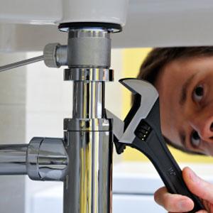 plumber in Mesa AZ finishes installing a new sink